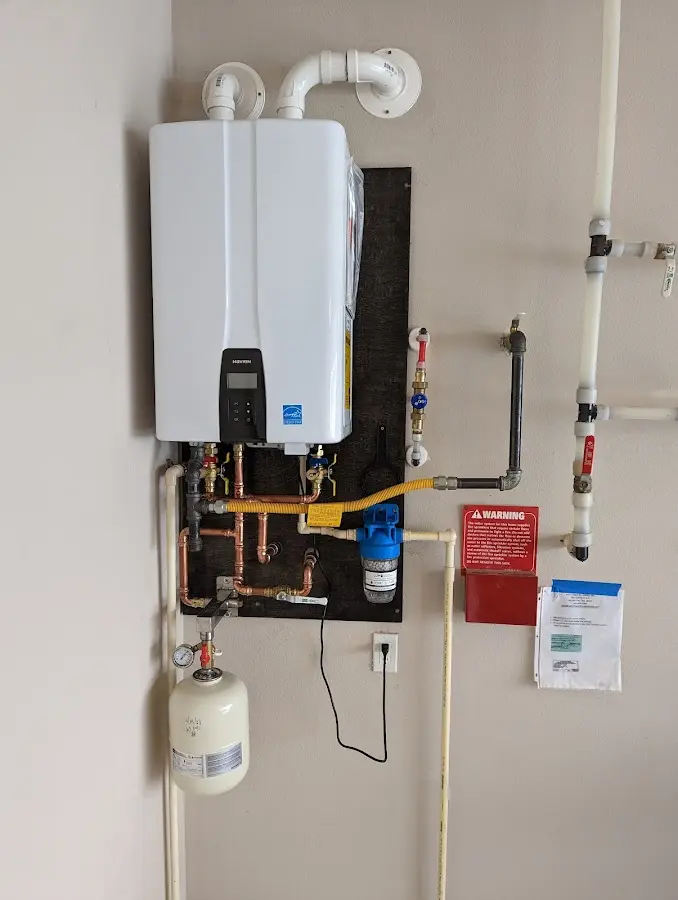 Professional plumber installing copper piping in a Willow Park home